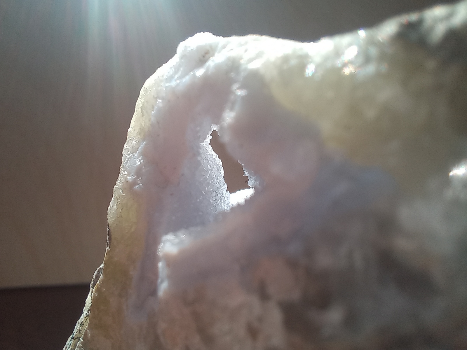 a little hole going through the rock which is filled with tiny crystals